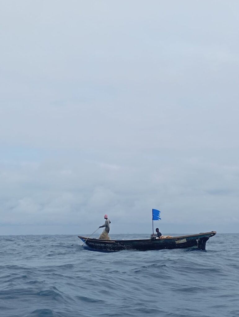 Whale Watching in Benin 3 Small fishing boat at sea off the coast of Cotonou, Benin.
